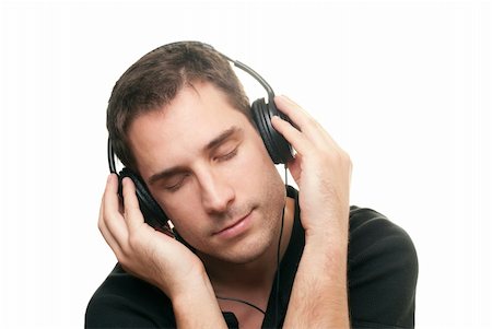 simsearch:400-04300097,k - handsome man listening the music. Isolated over white background Stock Photo - Budget Royalty-Free & Subscription, Code: 400-04301673