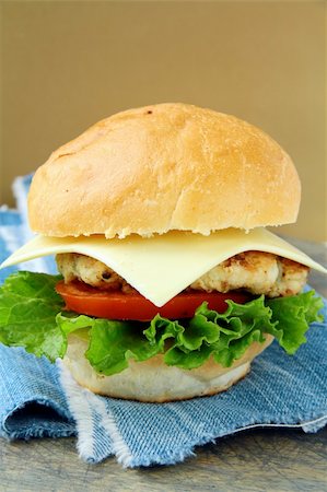 simsearch:400-06090558,k - Cheeseburger with cheese and tomatoes on a stylish denim napkins Stock Photo - Budget Royalty-Free & Subscription, Code: 400-04301709
