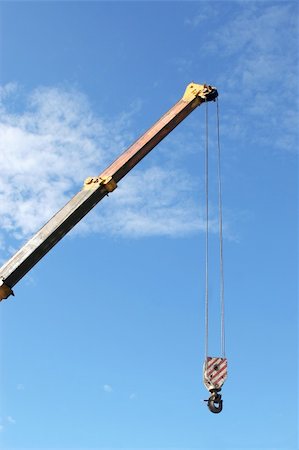 Crane with hook on blue sky background Stock Photo - Budget Royalty-Free & Subscription, Code: 400-04302939