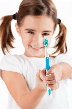 simsearch:400-04151137,k - portrait of a pretty Little girl holding a toothbrush Photographie de stock - Aubaine LD & Abonnement, Code: 400-04303405