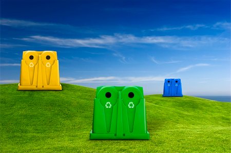 simsearch:400-07301131,k - Recycle containers for glass, metal, plastic and paper waste placed on a green meadow lansdscape Stock Photo - Budget Royalty-Free & Subscription, Code: 400-04303436