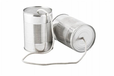 Closeup of tin cans telephone connected by string on white background, business communication concept Stock Photo - Budget Royalty-Free & Subscription, Code: 400-04303663