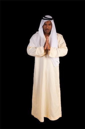 Arabian african man in traditional dress over a black background Stock Photo - Budget Royalty-Free & Subscription, Code: 400-04303683