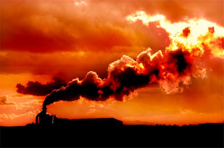 Factory belching out polution at sunset for a scene of global warming Stock Photo - Budget Royalty-Free & Subscription, Code: 400-04303692