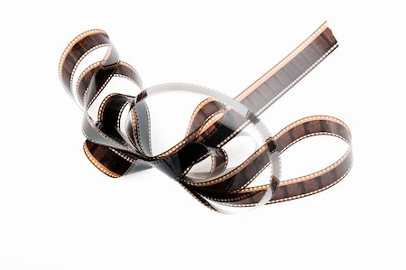 simsearch:400-05102933,k - Detailed close-up of an film strip, film reel on white Stock Photo - Budget Royalty-Free & Subscription, Code: 400-04303829