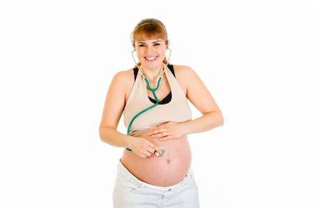 simsearch:400-04817039,k - Smiling pregnant woman holding stethoscope on her tummy isolated on white Stock Photo - Budget Royalty-Free & Subscription, Code: 400-04315966