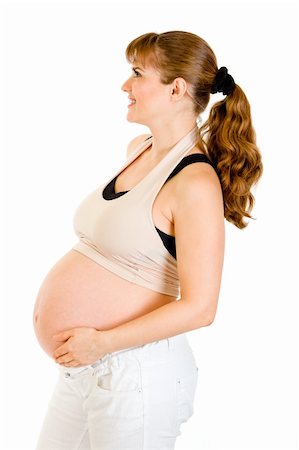 simsearch:400-04817039,k - Smiling beautiful pregnant woman holding her belly isolated on white background Stock Photo - Budget Royalty-Free & Subscription, Code: 400-04315961