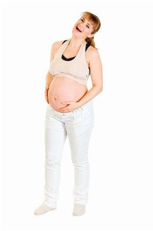 simsearch:400-04817039,k - Laughing pregnant holding her tummy isolated on white background Stock Photo - Budget Royalty-Free & Subscription, Code: 400-04315963