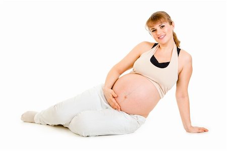 simsearch:400-04817039,k - Happy beautiful pregnant woman sitting on floor and holding her belly  isolated on white Stock Photo - Budget Royalty-Free & Subscription, Code: 400-04315988