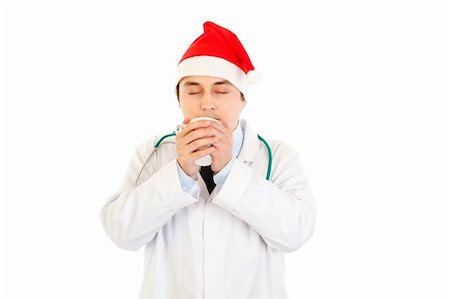 food specialist - Medical doctor in Santa hat enjoying cup of hot coffee isolated on white Stock Photo - Budget Royalty-Free & Subscription, Code: 400-04315998