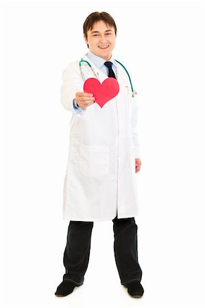 Smiling medical doctor holding paper heart in hand  isolated on white Stock Photo - Budget Royalty-Free & Subscription, Code: 400-04316015