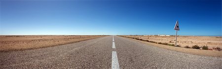 future of the desert - Straight road with nice blue sky in the south of Morocco Stock Photo - Budget Royalty-Free & Subscription, Code: 400-04316204