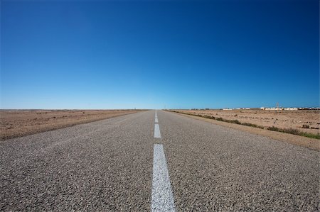 future of the desert - Straight road with nice blue sky in the south of Morocco Stock Photo - Budget Royalty-Free & Subscription, Code: 400-04316203