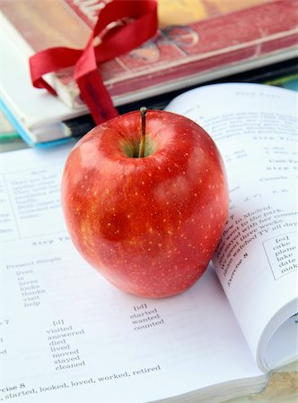 red ripe apple with English textbooks on a black background Stock Photo - Budget Royalty-Free & Subscription, Code: 400-04317858