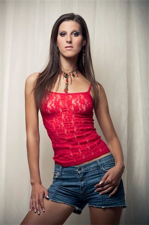 simsearch:400-04655693,k - attractive slim girl in red shirt blue short Stock Photo - Budget Royalty-Free & Subscription, Code: 400-04319407