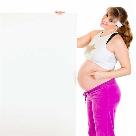simsearch:400-04798379,k - Smiling beautiful pregnant woman  pointing finger at blank billboard  isolated on white Stock Photo - Budget Royalty-Free & Subscription, Code: 400-04319927