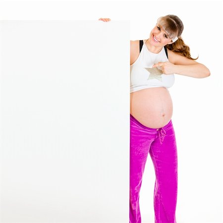 simsearch:400-04798379,k - Smiling beautiful pregnant woman  pointing finger at blank billboard  isolated on white Stock Photo - Budget Royalty-Free & Subscription, Code: 400-04310618