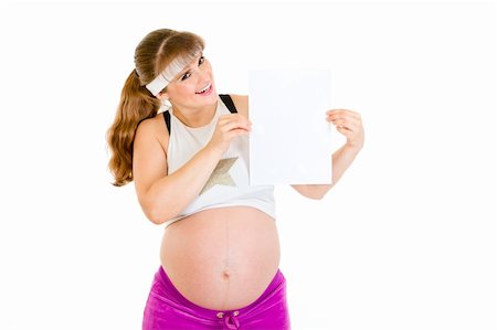 simsearch:400-04798379,k - Smiling beautiful pregnant woman holding empty white paper over her head isolated on white Stock Photo - Budget Royalty-Free & Subscription, Code: 400-04310620