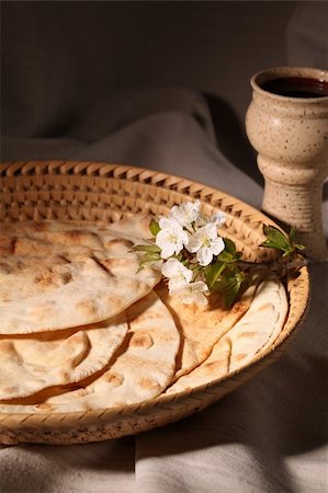 Chalice with red wine and pita bread in a basket Stock Photo - Budget Royalty-Free & Subscription, Code: 400-04311025