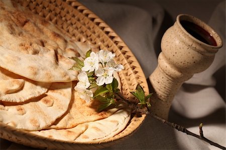 Chalice with red wine and pita bread in a basket Stock Photo - Budget Royalty-Free & Subscription, Code: 400-04311026