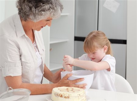 Girl baking with her grandmother at home Stock Photo - Budget Royalty-Free & Subscription, Code: 400-04311190