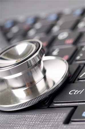 stethoscope on the laptop keyboard close up Stock Photo - Budget Royalty-Free & Subscription, Code: 400-04311819