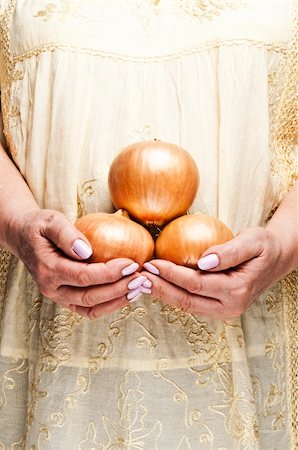 food cooking woman full - Housewife holding bunch of onion Stock Photo - Budget Royalty-Free & Subscription, Code: 400-04312173