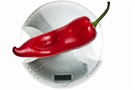 simsearch:400-04647880,k - Red pepper isolated on food scale Stock Photo - Budget Royalty-Free & Subscription, Code: 400-04312184
