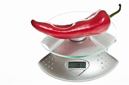 simsearch:400-04647880,k - Red pepper isolated on food scale Stock Photo - Budget Royalty-Free & Subscription, Code: 400-04312189