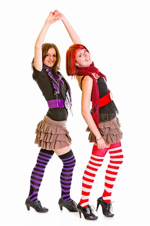 Two cheerful young girlfriends dancing for fun  isolated on white Stock Photo - Budget Royalty-Free & Subscription, Code: 400-04312488