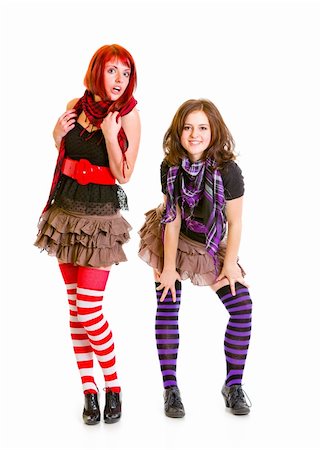 Two young girls  posing together isolated on white Stock Photo - Budget Royalty-Free & Subscription, Code: 400-04312490
