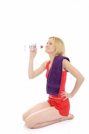 simsearch:400-05115517,k - Pretty fitness woman drinking water after training exercises. isolated on white background Stock Photo - Budget Royalty-Free & Subscription, Code: 400-04312764