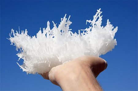 Hand holding salt crystals from salt lake against the sky Stock Photo - Budget Royalty-Free & Subscription, Code: 400-04324012