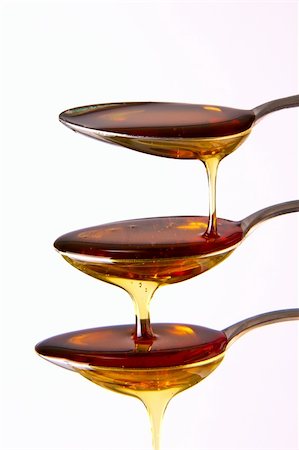 Syrup cascading down the spoons Stock Photo - Budget Royalty-Free & Subscription, Code: 400-04324669