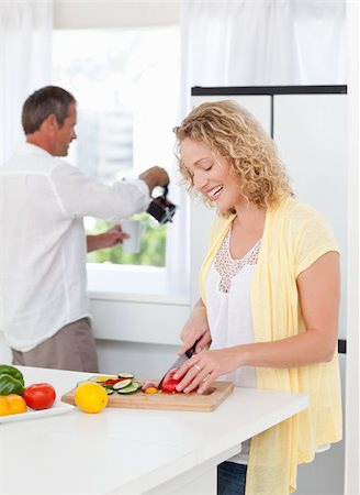 simsearch:400-05744780,k - Couple cooking together in their kitchen at home Stock Photo - Budget Royalty-Free & Subscription, Code: 400-04324720