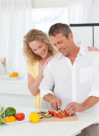 simsearch:400-05744780,k - Couple cooking together in their kitchen at home Stock Photo - Budget Royalty-Free & Subscription, Code: 400-04324747