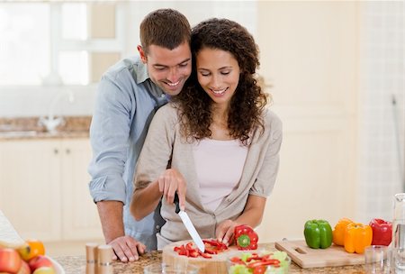simsearch:400-05744780,k - Handsome man cooking with his girlfriend at home Stock Photo - Budget Royalty-Free & Subscription, Code: 400-04325205