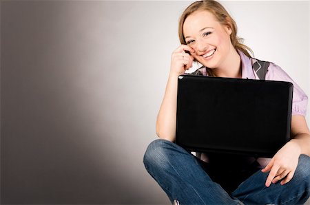 plump girls - young woman is working on laptop sitting on table at office Stock Photo - Budget Royalty-Free & Subscription, Code: 400-04325516