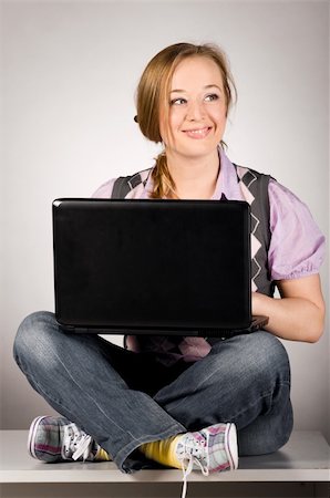 plump girls - young woman is working on laptop sitting on table at office Stock Photo - Budget Royalty-Free & Subscription, Code: 400-04325517