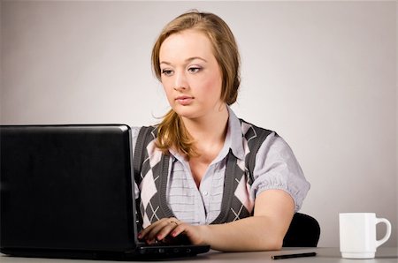 plump girls - young woman is working on laptop  at office Stock Photo - Budget Royalty-Free & Subscription, Code: 400-04325512
