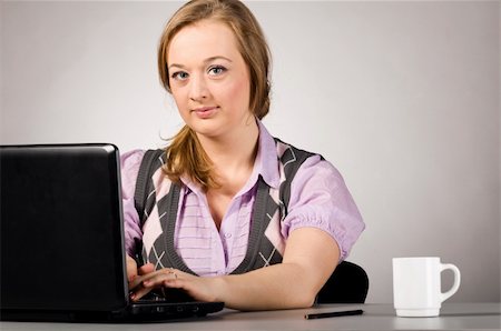 plump girls - young woman is working on laptop  at office Stock Photo - Budget Royalty-Free & Subscription, Code: 400-04325513