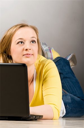 plump girls - young lying woman is working on laptop on floor Stock Photo - Budget Royalty-Free & Subscription, Code: 400-04325527
