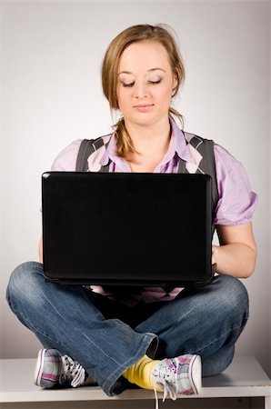 plump girls - young woman is working on laptop sitting on table at office Stock Photo - Budget Royalty-Free & Subscription, Code: 400-04325520