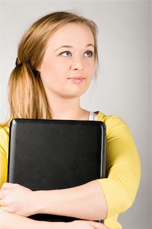 plump girls - young woman is holding laptop in hands Stock Photo - Budget Royalty-Free & Subscription, Code: 400-04325530