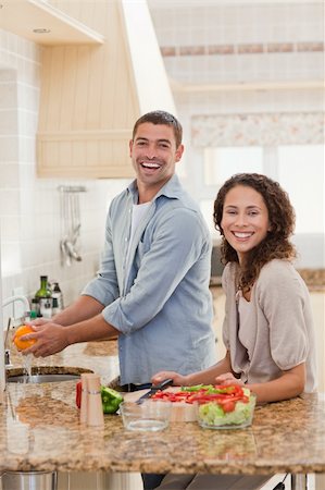 simsearch:400-05744780,k - Handsome man cooking with his girlfriend at home Stock Photo - Budget Royalty-Free & Subscription, Code: 400-04325583