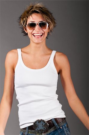 simsearch:400-04325969,k - woman wearing white tank top and jeans Foto de stock - Super Valor sin royalties y Suscripción, Código: 400-04325979