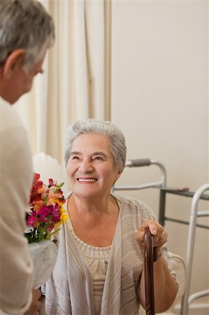 shoulder old lady white - Retired man offering flowers to his wife Stock Photo - Budget Royalty-Free & Subscription, Code: 400-04326116