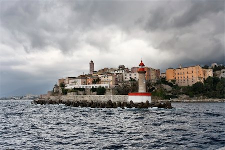 simsearch:841-06445552,k - France, Corsica, Bastia, view of the port light and the town Stock Photo - Budget Royalty-Free & Subscription, Code: 400-04326307