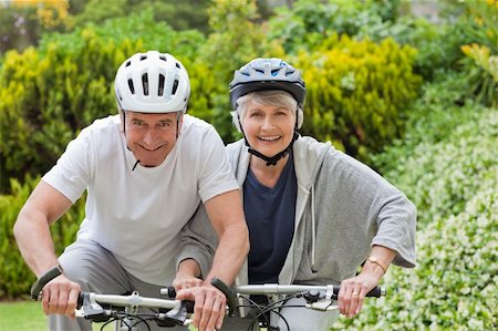 Senior couple mountain biking outside Stock Photo - Budget Royalty-Free & Subscription, Code: 400-04326531