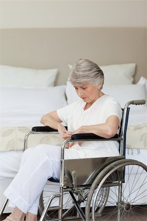 Senior woman asleep in her wheelchair at home Stock Photo - Budget Royalty-Free & Subscription, Code: 400-04326668